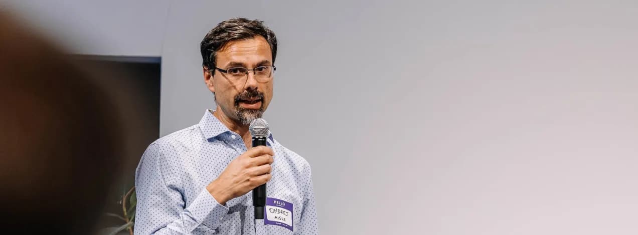 Ondrej Vlcek, AISLE CEO and co-founder, speaking on stage